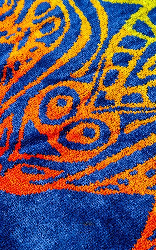 05158-1 Toalla playera jacquard de algodón con estampado.